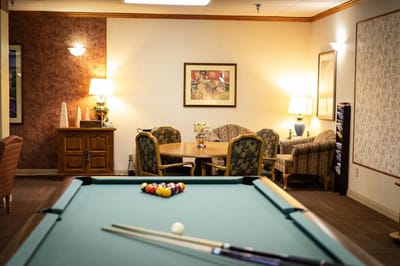 Interior view of a common area with a billiard table