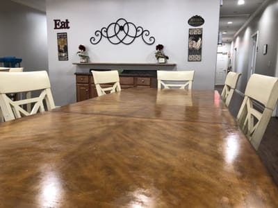 Interior view of a dining room with wooden table and chairs