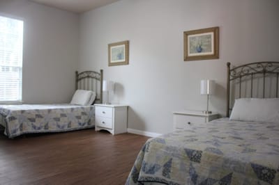 Simple interior room with two beds and decor