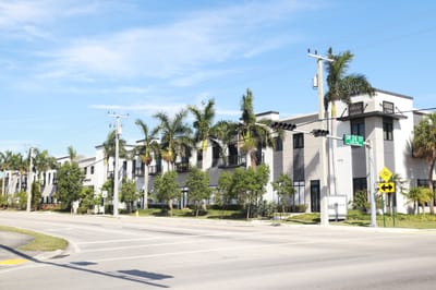 Modern assisted living facility with palm trees