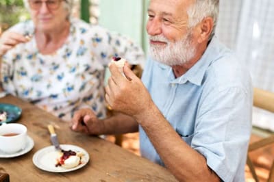 Residents enjoying a meal together in a dining area