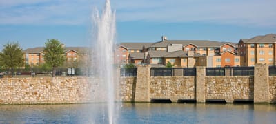 Exterior view of Highland Springs Senior Living with water feature