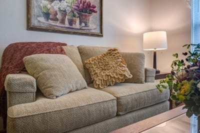 Cozy sitting area with a couch and lamp