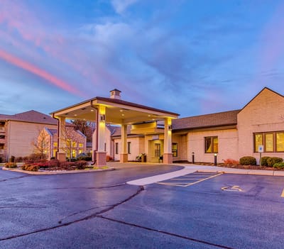 Exterior view of Harbour Village entrance at dusk