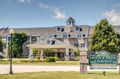 Exterior view of Deer Creek Village building and sign