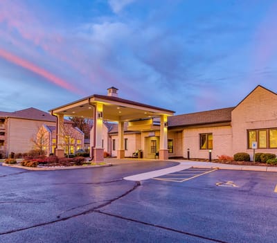 Exterior view of Harbour Village with sunset sky