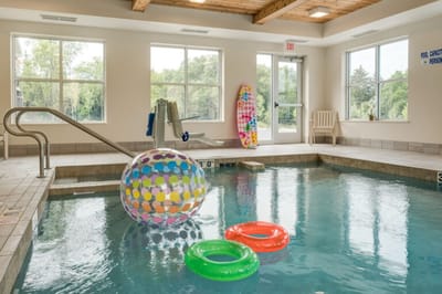 Indoor swimming pool with colorful floats