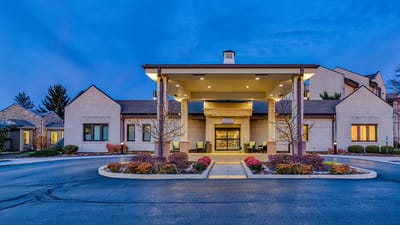 Front entrance of Harbour Village facility at dusk