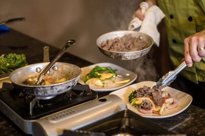 Chef preparing a meal in a kitchen setting