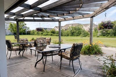 Outdoor seating area with tables and chairs