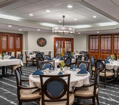 Elegant dining room with set tables and decor