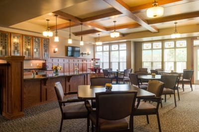 Bright dining area with tables and chairs