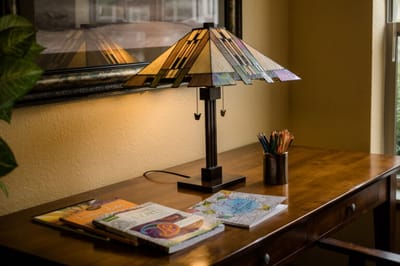 Cozy interior with a lamp and books on a desk