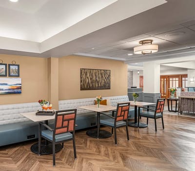 Bright dining area with tables and seating