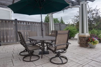 Outdoor patio seating area with an umbrella