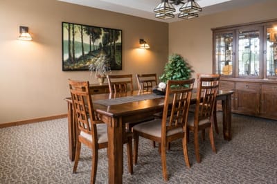Interior view of a dining room with wooden table and chairs