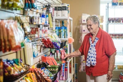 A resident shopping in a facility store