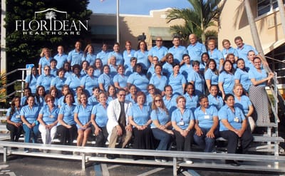 Group photo of Floridean Healthcare staff in blue shirts