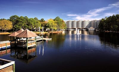 Scenic view of the lake with facility buildings in the background