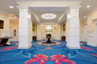 Bright interior lobby with colorful carpet and decor
