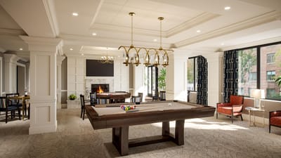 Well-lit common area with a pool table and seating