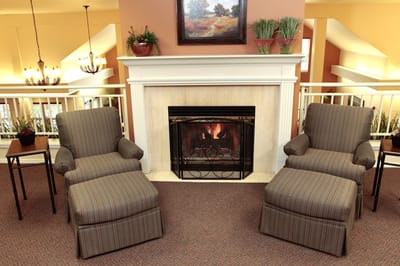 Cozy seating area with a fireplace in a common space