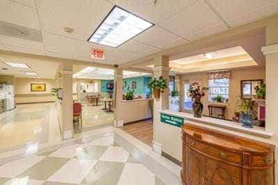 Bright interior of a senior living facility with nurse's station