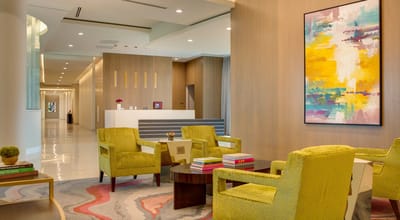 Bright lobby area with colorful furniture and artwork
