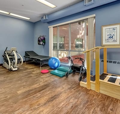 Interior view of a fitness or therapy room with equipment