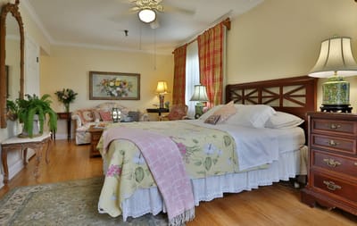 A cozy resident room with floral decor and bright lighting