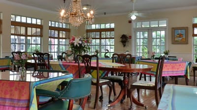 Interior dining room with tables and chandeliers