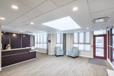 Reception area with seating and natural light