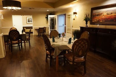 Dining area with tables and chairs set for a meal