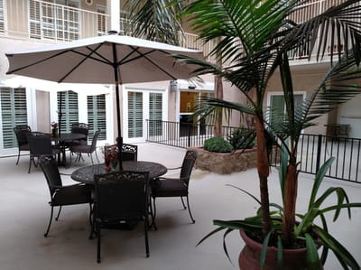 Outdoor courtyard seating area with tables and plants