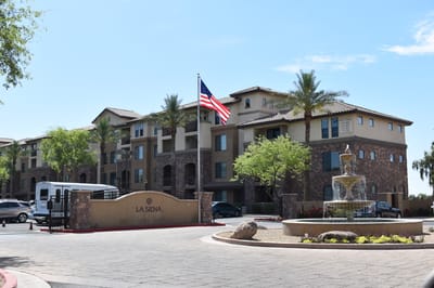 Exterior view of La Siena with flag and entry signage