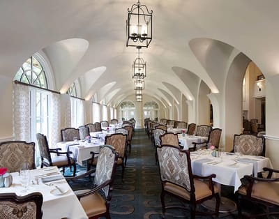 Elegant dining area with tables and chairs