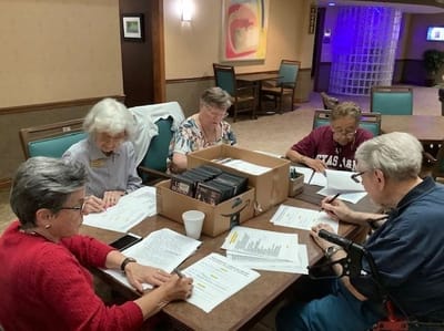 Residents participating in an activity at a table