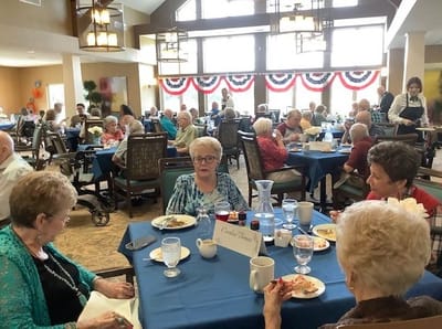 Residents enjoying a meal in the dining room