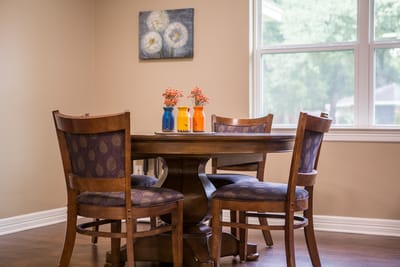 Cozy dining table with chairs in a common area