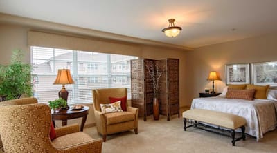 A cozy resident room with comfortable furniture