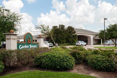 Exterior view of Garden Terrace at Houston with landscaping