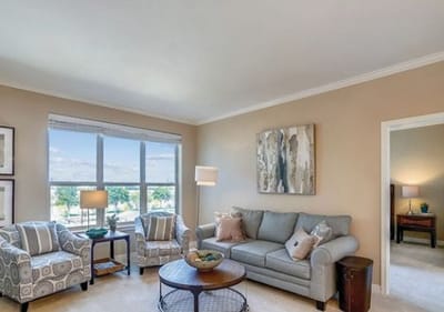 Cozy living room with comfortable seating and large windows