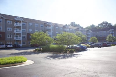 Exterior view of The Crossings at Bon Air with parking and landscaping
