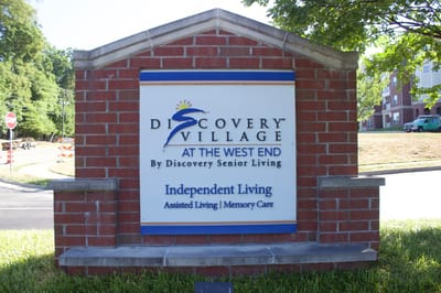 Sign displaying 'Discovery Village' and services offered