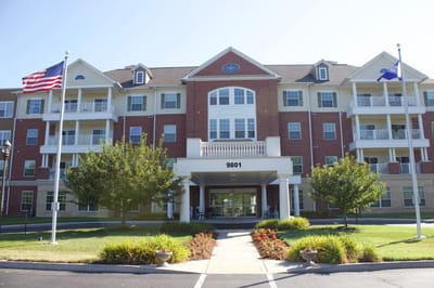 Exterior view of Discovery Village building with flags