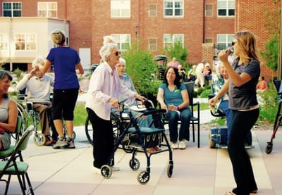 Residents enjoying an outdoor activity in the garden space