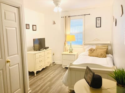 Cozy private room showcasing a bed and furniture