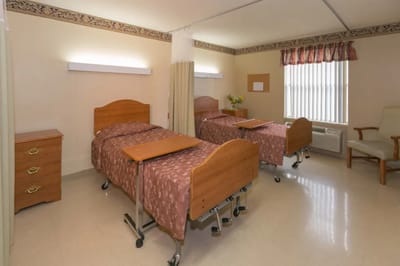 Shared resident room with two beds and a window