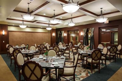 Elegant dining room setup with tables and chairs