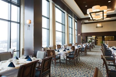 Elegant dining room with tables set for a meal